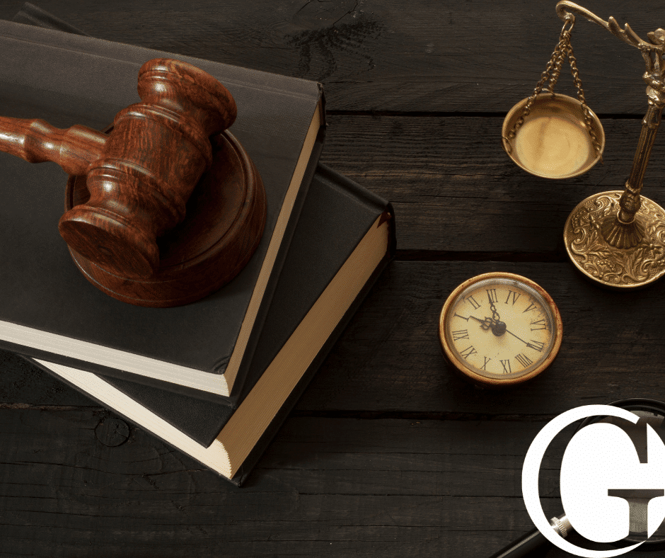 Gavel on law books next to justice scales