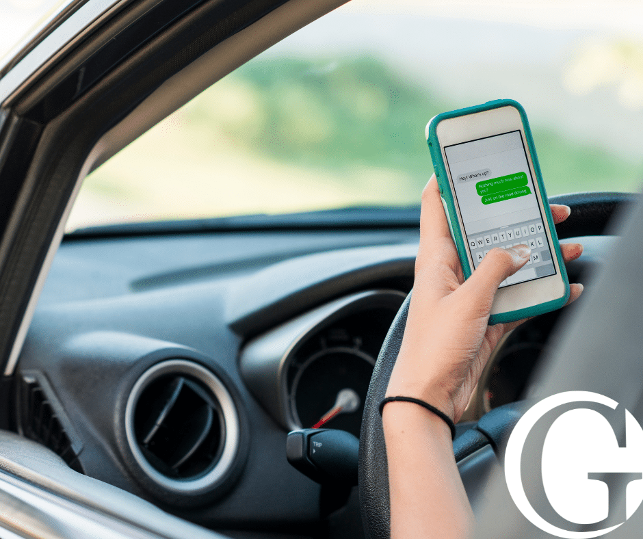 Person using their phone while driving