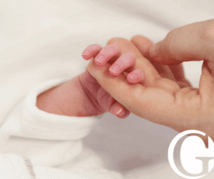 Closeup of mother holding a baby's hand