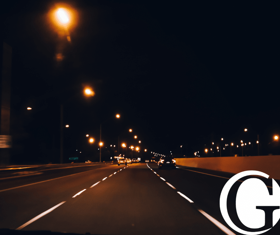 Dark city highway lit up by streetlights