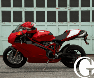 Motorcycle parked in front of a garage