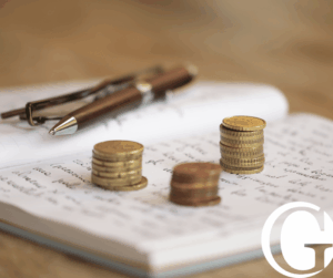 Piles of coins on an open notebook